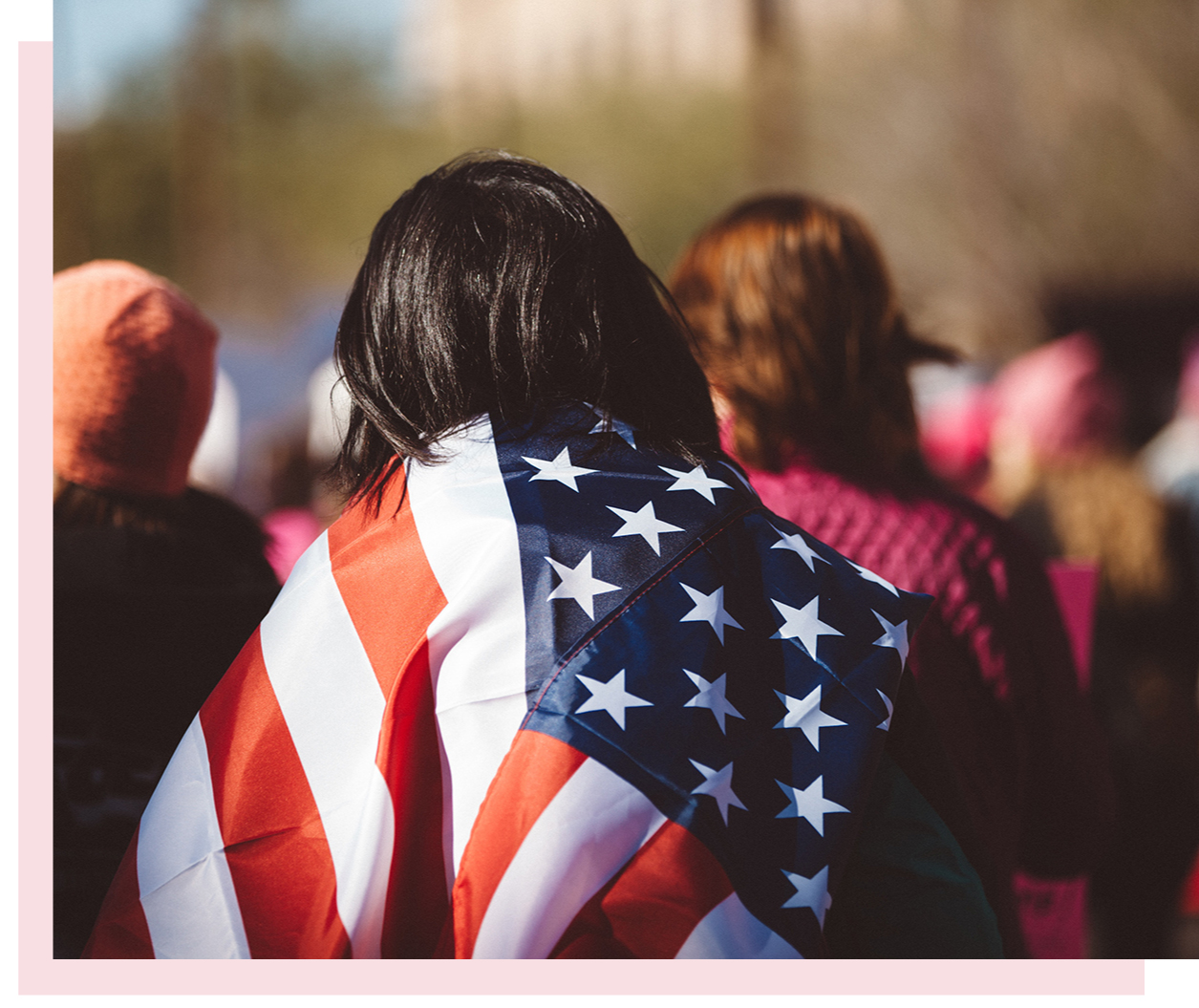 Recognize and Reflect | a woman wearing the American flag in a crowd